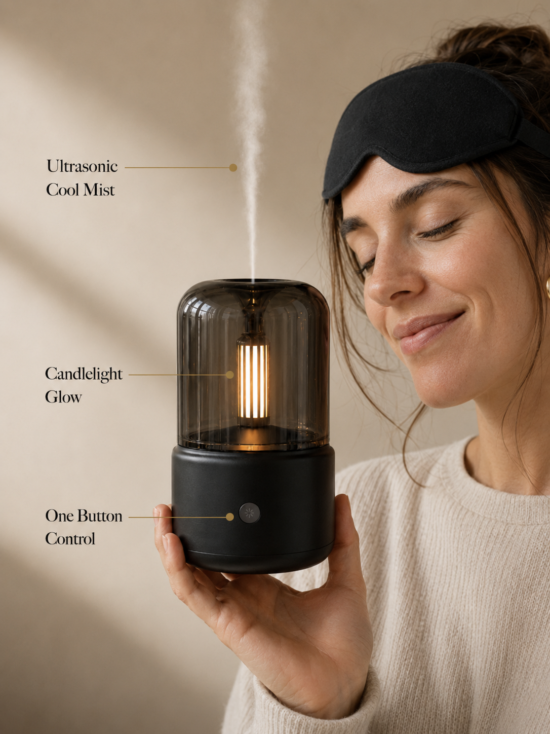 Black diffuser with warm mist on a soft neutral tabletop, featuring labeled callouts for cool mist, candlelight glow, and modern glass design.